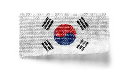 South Korean flag on a piece of cloth on a white background