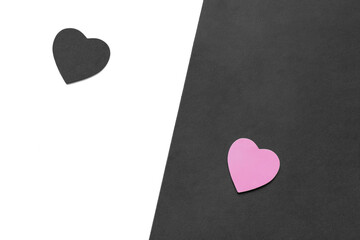 Yin and yang with hearts. Choose between good and evil. Being good or bad concept. Broken wounded heart on border of good and evil. Flat lay. Top view