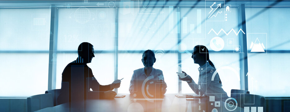 Double exposure of virtual screen and colleagues at business meeting in office