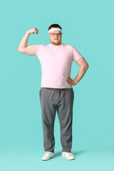 Fototapeta na wymiar Overweight man on color background. Weight loss concept