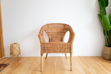 weave chair on wooden floor in living room.