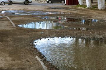 Due to technology of violations in construction of roads, Extreme cold and heavy rains washed away asphalt road and formed numerous cracks and dangerous failures