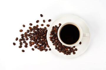 Coffee cup and coffee beans isolated on white background. Top view.