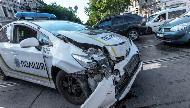 ODESSA, UKRAINE - July 11, 2016: Crash accident on the street with a police crew. Police car during the chase the offender lost control and created a major accident. Broken car in the collision