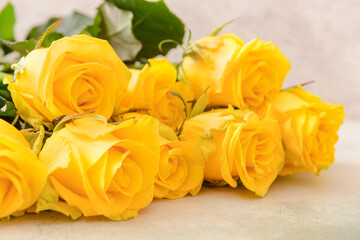 Beautiful yellow roses on table