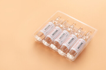 Vaccine for immunization against COVID-19 on color background