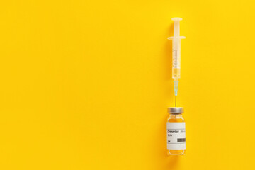 Vaccine for immunization against COVID-19 and syringe on color background - obrazy, fototapety, plakaty