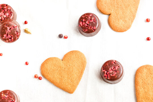 Valentine's Day cookies and chocolates isolated on white. Love and valentine's day background. Top view