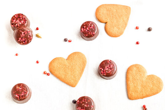 Valentine's Day cookies and chocolates isolated on white. Love and valentine's day concept. Top view