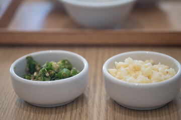 Condiments of slice fresh garlic and slice fresh chili for Shabu and Sukiyaki