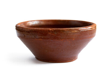 Old rough earthenware bowl close up isolated on white background