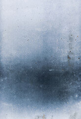 Blue weathered background. Concrete wall texture. Stained surface with dust scratches abstract black grainy noise defect pattern. Distressed rough surface.