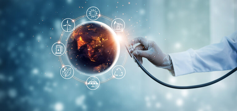 Earth at night being checked by a doctor with a stethoscope with energy resources icon. Abstract of environment. Earth day. Energy saving concept.