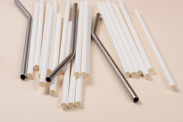 Eco Friendly Drinking Straws. Sustainable lifestyle concept. Champagne colour background.