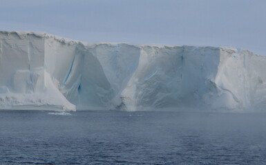 Fototapeta na wymiar Antarctica ice cold icebergs sea and blue sky
