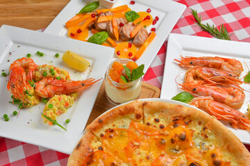 Italian cuisine concept flat lay, top view. Persimmon dishes menu, pizza, shrimps, salad, dessert.