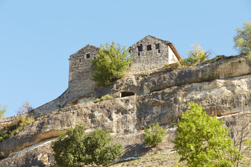 house in the rock with white walls