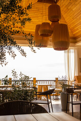 tables and chairs on the wooden veranda