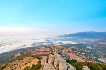 sunrise on the coast in clouds and mountains