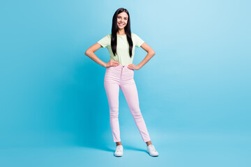 Fototapeta na wymiar Full length body size view of pretty slender tall cheerful girl wearing spring look posing isolated over bright blue color background