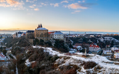 Fototapeta na wymiar Veszprem city castle aera aerial photo in winter with snow. Amazing city part with historical old houses, church and much more. The most beautiful part of this city.