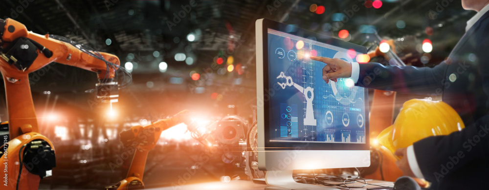 Aufkleber Manager industrial engineer pointing on panel screen working and control robotics with monitoring system software industry network connection. AI. Artificial Intelligence. Automation robot arm.
