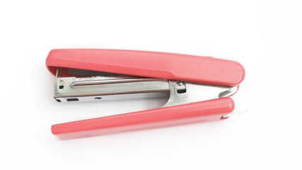red stapler isolated on white