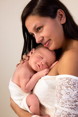 Fototapeta na wymiar Tender mother with newborn baby