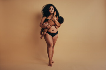 Plus size mother with her infant