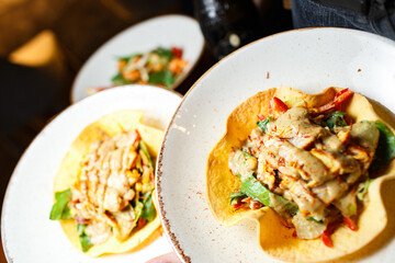 mexican appetizer in a white plate close-up on a dark background