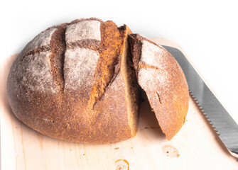 Wholemeal bread sliced on wooden board