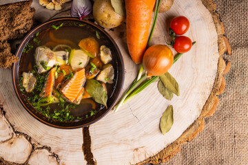 Fresh fish soup with ingredients and spices for cooking. Salmon soup.  Clean eating, healthy and diet food concep
