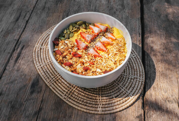 Healthy food smoothie bow Fresh fruit smoothie is good for the body. Or a juice smoothie There are a variety of fruit and vegetables ingredients placed on the wooden table.