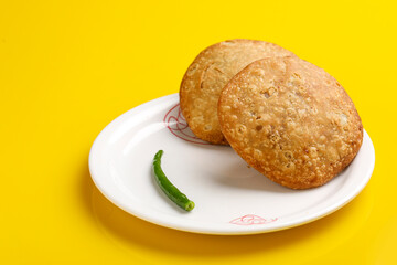 Kachori is a spicy snack from India also spelled as kachauri and kachodi. Served with tomato ketchup. Favorite Tea time snacks