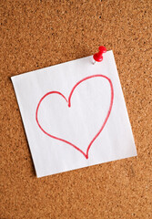 Sticker with love words written by pen, drawn heart and compliments for valentine s day  at corkboards background.