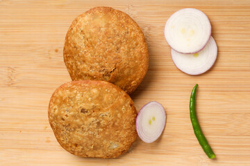 Obraz na płótnie Canvas Kachori is a spicy snack from India also spelled as kachauri and kachodi.