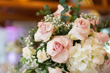 Wedding reception table decorated with fresh flowers