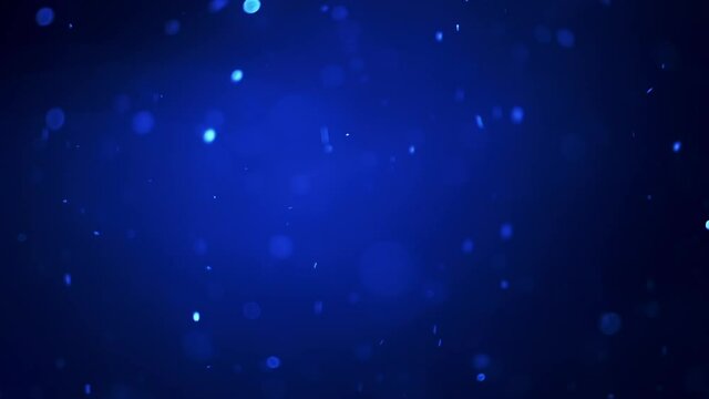 Real snow. Snowflakes fall at night with different speed. Natural snow isolated on the dark blue background