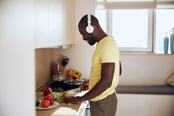 Cook listening to music while preparing food