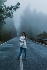 Girl in the middle of a snowy road