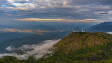 sunset over the green mountains landscape with sky and clouds of Ooty. Ooty or Ootacamund or Udhagamandalam is a popular hill station in India