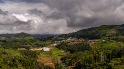 Fototapeta na wymiar ooty village of green mountains landscape with sky and clouds . Ooty or Ootacamund or Udhagamandalam is a popular hill station in India