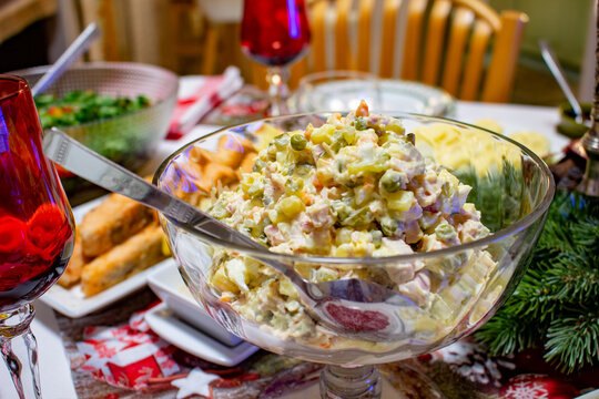 Olivier Salad. Russian salad with variable ingredients, made with chopped vegetables, meat, and mayonnaise.