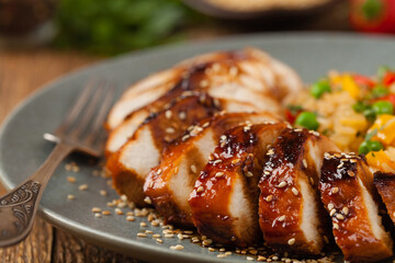 Grilled chicken breast in teriyaki sauce. Served with brown rice and vegetables.