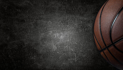 Basketball ball on dark concrete wall texture background. Background for product display, banner, or mockup - Powered by Adobe