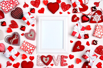 Mock up photo frame with hearts and gifts on white background for valentines day concept.
