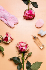 Arrangement of rose flowers and beauty tools and treatment