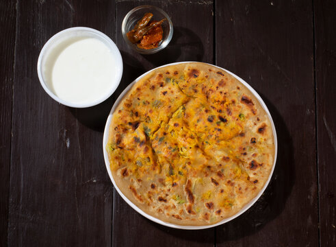 Indian Breakfast Dish Paneer Paratha Serve With Curd Or Chutney