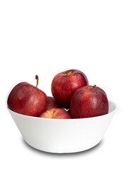 fresh red apples with droplets of water. in a white bowl.  on white background and clipping path.