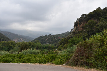 Fototapeta na wymiar road and green mountains in the background